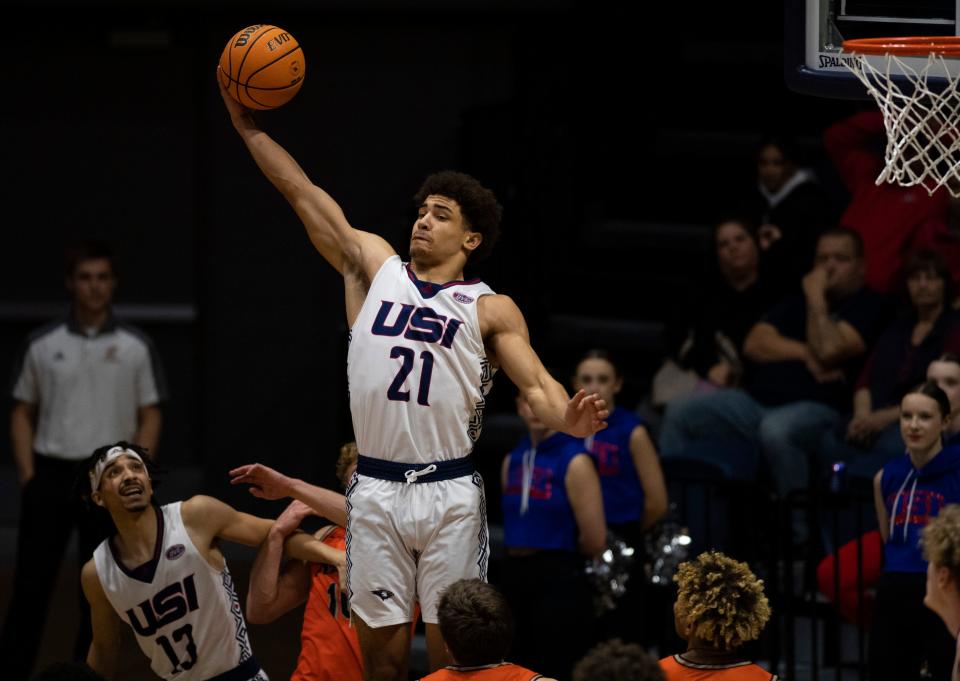 Southern Indiana’s AJ Smith (21) pulls down a rebound as the University of Southern Indiana Screaming Eagles play the Anderson University Ravens at Screaming Eagles Arena in Evansville, Ind., Wednesday, Dec. 7, 2022. 