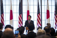 Japan's Prime Minister Shinzo Abe delivers his speech during the 60th anniversary commemorative reception of the signing of the Japan-US security treaty at the Iikura Guesthouse in Tokyo, Sunday, Jan. 19, 2020. (Behrouz Mehri/Pool via AP)