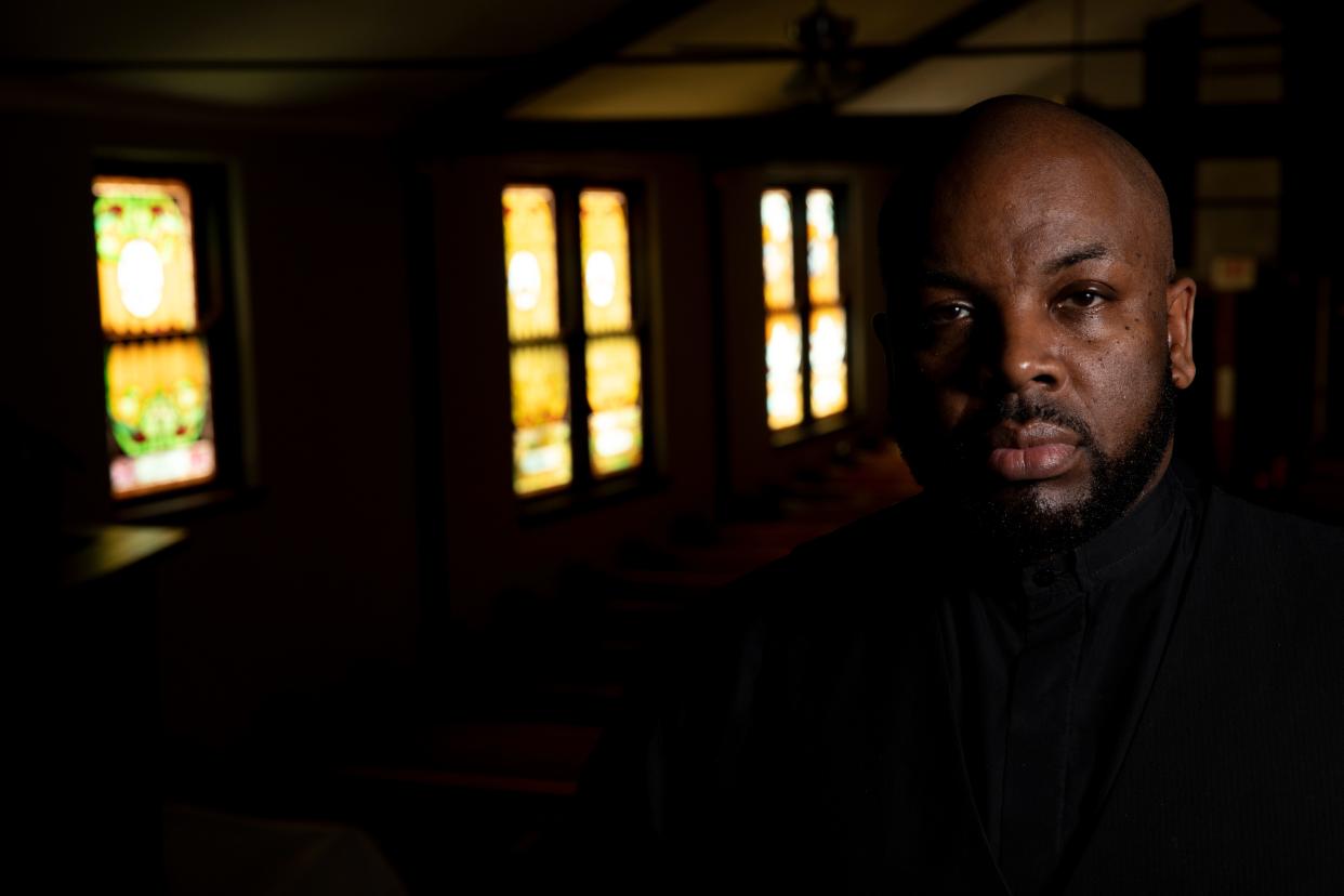 Bryan Walker, Walker Funeral Homes manager and the pastor of Bethel Baptist Church, stands inside the church. Walker said he's done more funerals the past two years than he's ever done in his 10 years as a funeral home director.