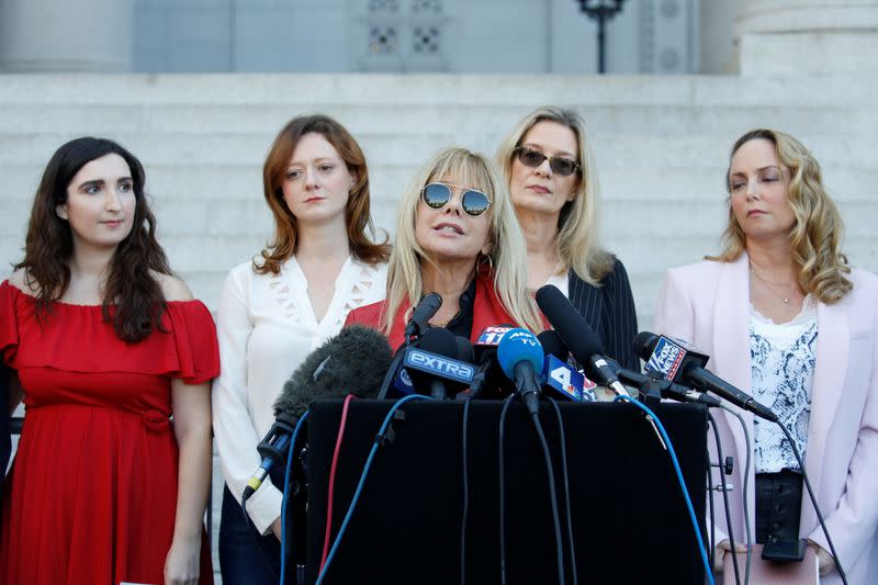 Rosanna Arquette speaks with " The Silence Breakers" Sarah Ann Masse, Lauren O'Connor, Louise Godbold and Louisette Geiss, during a news conference outside Los Angeles City Hall