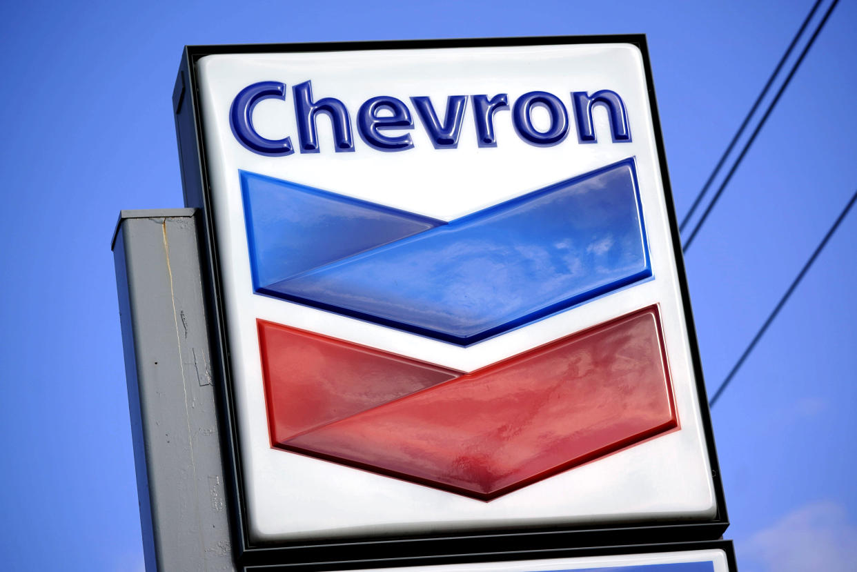 FILE - A Chevron sign is displayed outside one of the company's gas stations in Bradenton, Fla., on Tuesday, Feb. 22, 2022. More than 500 workers at a Chevron Corp. refinery in the San Francisco Bay area have told the company they will go on strike at 12:01 a.m. Monday, March 21, 2022. The United Steelworkers union says Sunday, March 20 that members of Local 5 voted down Chevron's most recent contract offer and gave notice of intent to go on strike. The statement says Chevron refused to return to the bargaining table. (AP Photo/Gene J. Puskar, File)