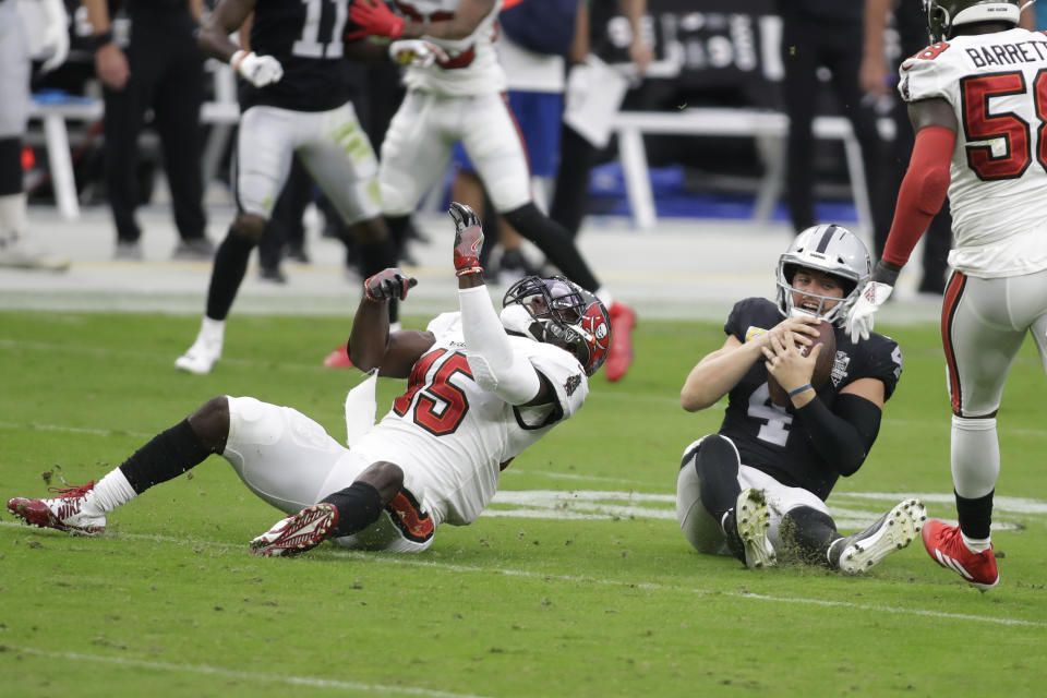 Tampa Bay Buccaneers inside linebacker Devin White (45) sacks Las Vegas Raiders quarterback Derek Carr (4) during the first half of an NFL football game, Sunday, Oct. 25, 2020, in Las Vegas. (AP Photo/Isaac Brekken)