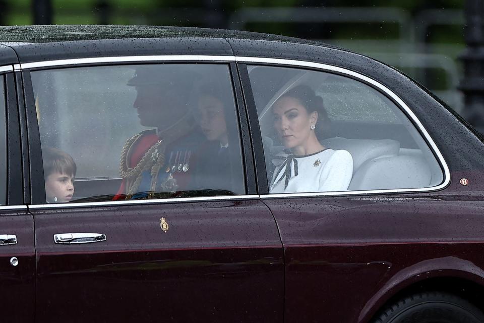 topshot britains catherine, princess of wales, r arrives with britains prince william, prince of wales, rear c and their children britains prince george of wales c and britains prince louis of wales l to buckingham palace before the kings birthday parade trooping the colour in london on june 15, 2024 the ceremony of trooping the colour is believed to have first been performed during the reign of king charles ii since 1748, the trooping of the colour has marked the official birthday of the british sovereign over 1500 parading soldiers and almost 300 horses take part in the event photo by henry nicholls afp photo by henry nichollsafp via getty images