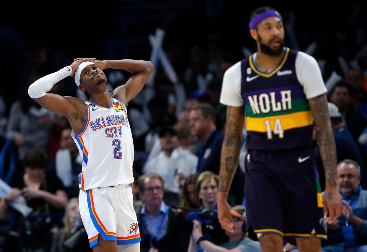 Oklahoma City's Shai Gilgeous-Alexander (2) reacts to a call next to New Orleans' Brandon Ingram (14) in the second half during the NBA basketball game between the Oklahoma City Thunder and the New Orleans Pelicans at the Paycom Center in Oklahoma City, Monday, Feb.13, 2023. 