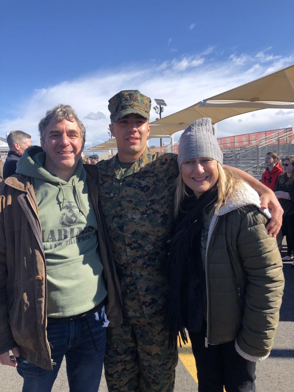 U.S. Marine 2nd Lt. Matthew Weiss of Tenafly, New Jersey, with parents, Peter and Louise, after graduating from Marine Officers' Candidate School in Quantico, Virginia. After receiving his BA and MBA from University of Pennsylvania and then working for a defense contractor, Weiss joined the Marines. He has now written a book on how the Pentagon can improve recruiting with Generation Z.