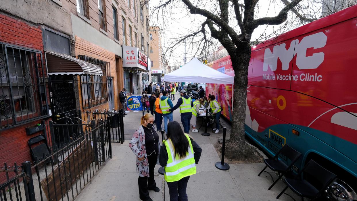 An NYC Mobile Vaccine Clinic bus is seen parked on Seventh Ave. and 54th St. in Brooklyn early Wednesday, April 7, 2021.