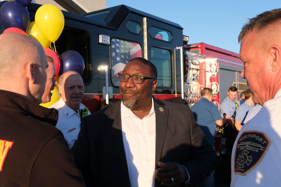Feb 5, 2024; Northport, Alabama, USA; The City of Northport put the new Engine 1 in service at City Hall Monday, replacing a fire truck that was 24 years old. Northport City Councilman Woodrow Washington shakes hands with firefighters.