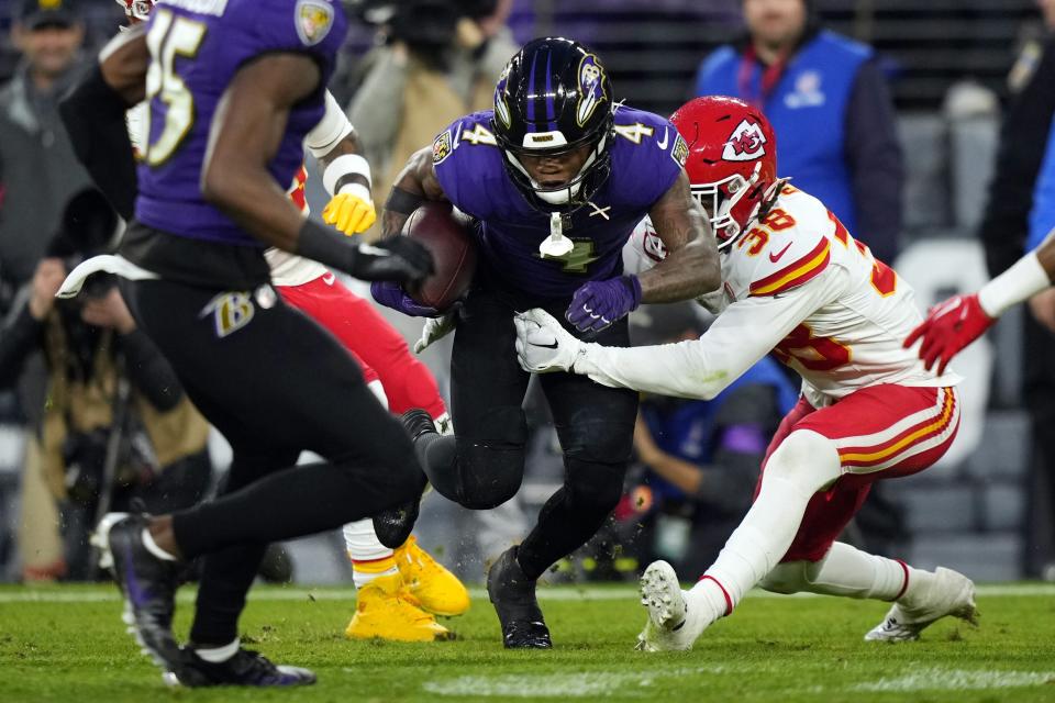 Baltimore Ravens wide receiver Zay Flowers (4) runs with the ball under pressure from Kansas City Chiefs cornerback L'Jarius Sneed (38) during the second half of the AFC Championship NFL football game, Sunday, Jan. 28, 2024, in Baltimore. (AP Photo/Matt Slocum)