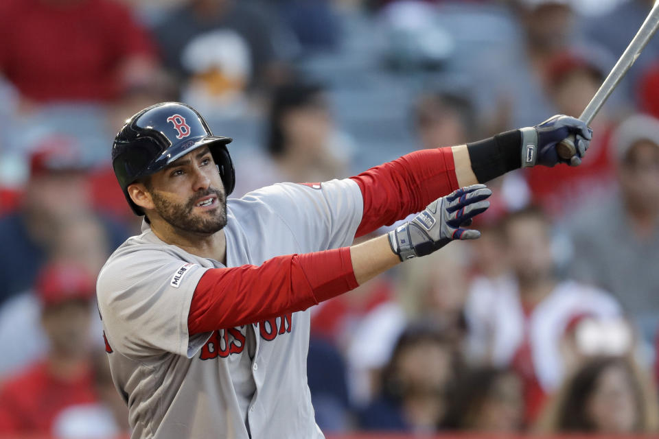 Boston Red Sox's J.D. Martinez watches his RBI-double against the Los Angeles Angels during the first inning of a baseball game in Anaheim, Calif., Saturday, Aug. 31, 2019. (AP Photo/Chris Carlson)