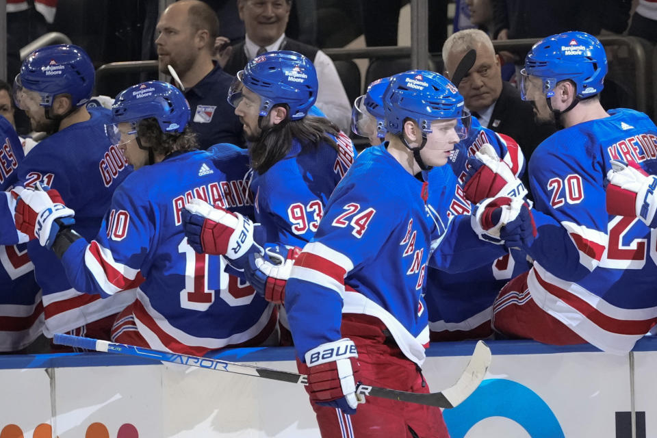 New York Rangers' Kaapo Kakko (24) celebrates with teammates after scoring a goal against the Tampa Bay Lightning during the first period of an NHL hockey game Wednesday, April 5, 2023, in New York. (AP Photo/Frank Franklin II)