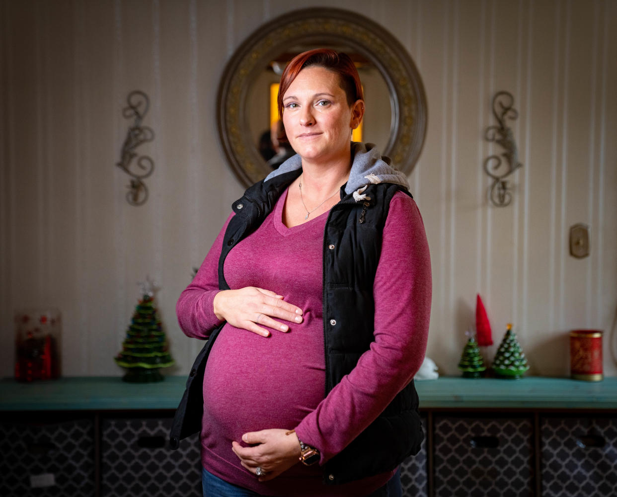 Ashley Greene, who is carrying her third surrogate pregnancy, stands for a photo at her home in Clinton, Wednesday, Dec. 14, 2022.