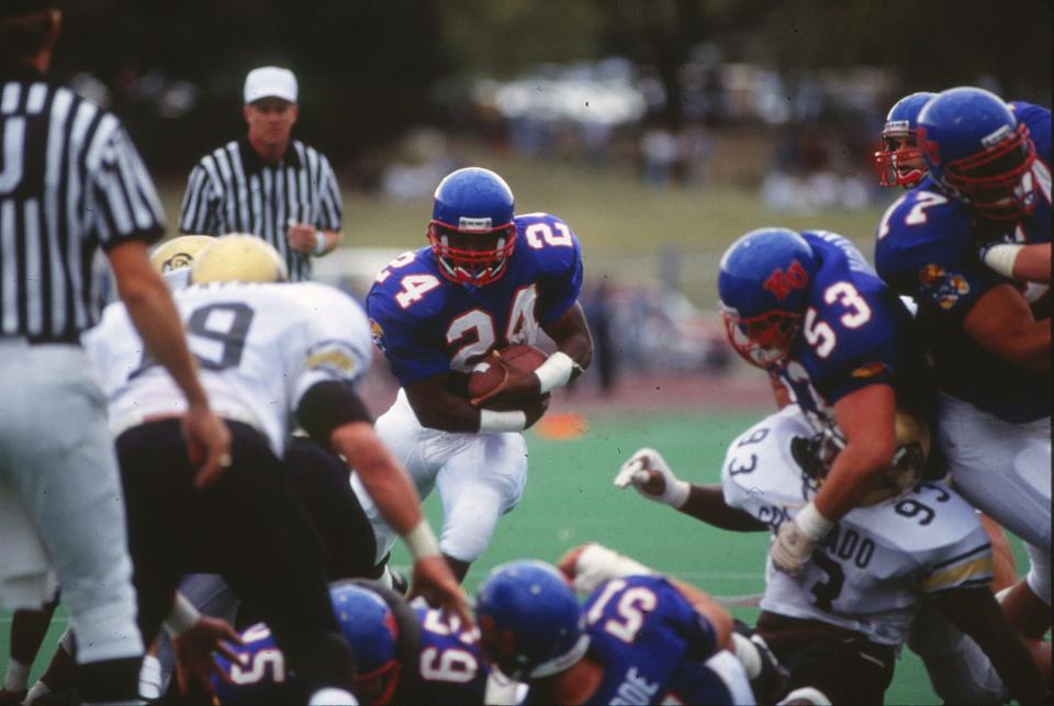 Tony Sands starred for the Kansas Jayhawks' football team at running back during his college career. He will be inducted into the program's Ring of Honor this year.