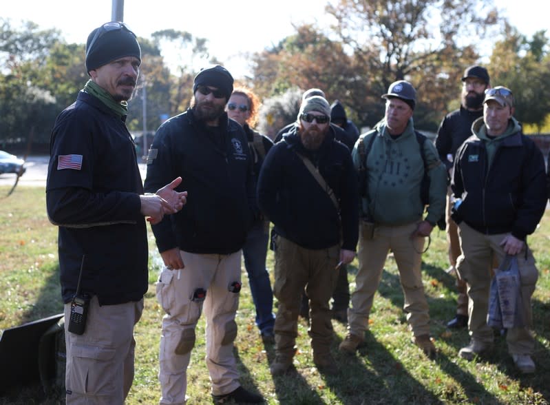 Militia members and pro-gun rights activists participating in the "Declaration of Restoration" rally prepare to march to Washington, D.C. from Arlington, Virginia