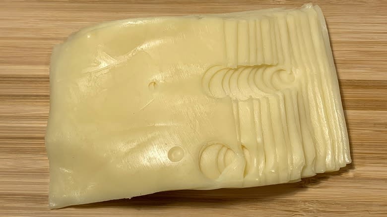 swiss cheese slices on board