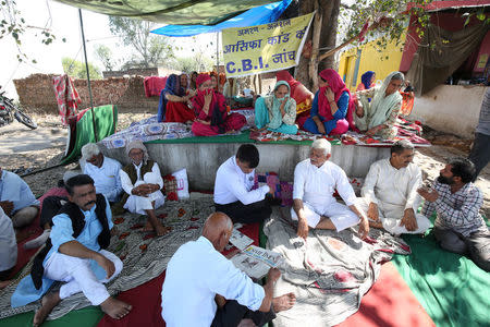 Villagers sit on a hunger strike demanding a Central Bureau of Investigation (CBI) probe into the rape and murder of an eight-year-old girl in Kathua district, south of Jammu, April 12, 2018. REUTERS/Mukesh Gupta