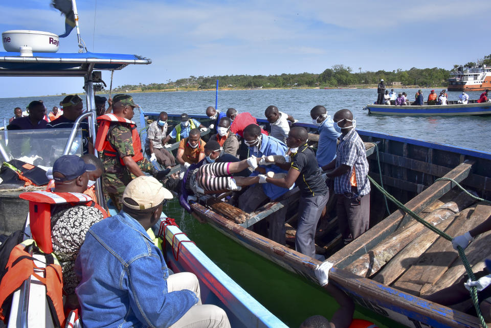 EDS NOTE: RETRANSMISSION NAI111 OF FRIDAY, SEPT. 21, 2018, FOR IMPROVED QUALITY. Rescuers retrieve a dead body from the water near Ukara Island in Lake Victoria, Tanzania, Friday, Sept. 21, 2018. The death toll rose above 100 after the passenger ferry MV Nyerere capsized on Lake Victoria, Tanzania state radio reported Friday, while a second day of rescue efforts raced the setting sun. (AP Photo)