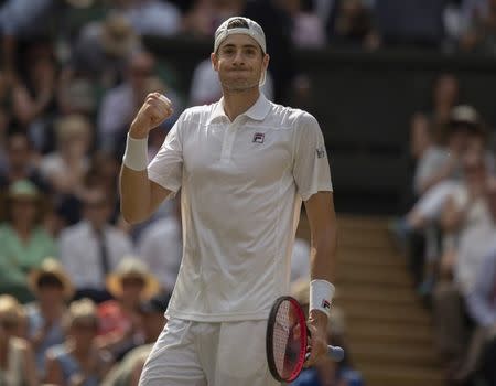 Jul 13, 2018; London, United Kingdom; John Isner (USA) reacts during his match against Kevin Anderson (RSA) on day 11 at All England Lawn and Croquet Club. Mandatory Credit: Susan Mullane-USA TODAY Sports