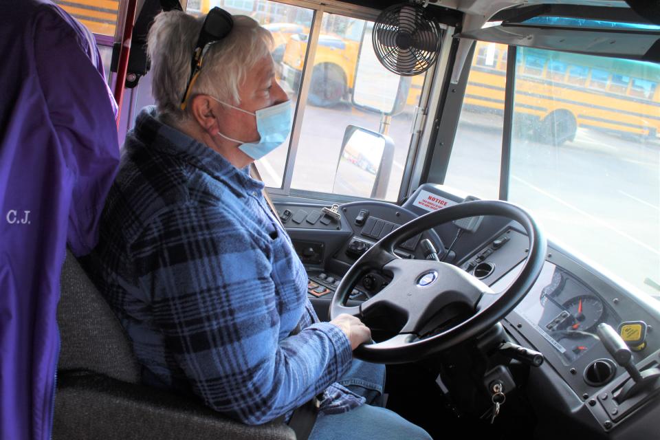 C. J. Swain, a longtime Fremont City Schools bus driver, waits for students to arrive on her bus Nov. 19. Swain has been driving a bus for the school district for 25 years. She said she's never seen a shortage of substitute bus drivers like she's seen this year.