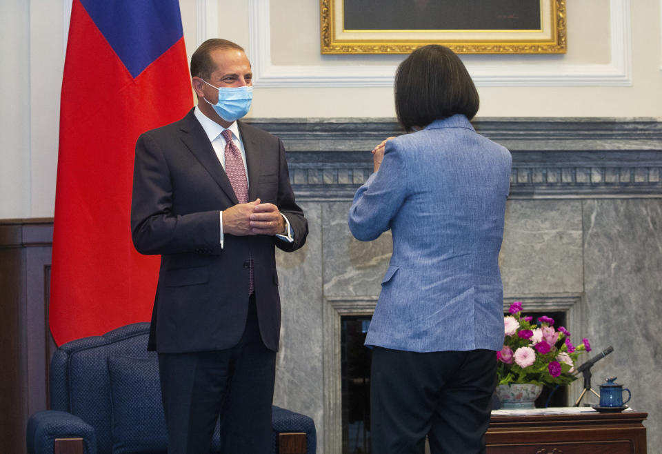 U.S. Health and Human Services Secretary Alex Azar, left, is greeted by Taiwan's President Tsai Ing-wen, right, during a meeting in Taipei, Taiwan Monday, Aug. 10, 2020. Azar met with Tsai on Monday during the highest-level visit by an American Cabinet official since the break in formal diplomatic ties between Washington and Taipei in 1979. (Pool Photo via AP Photo)