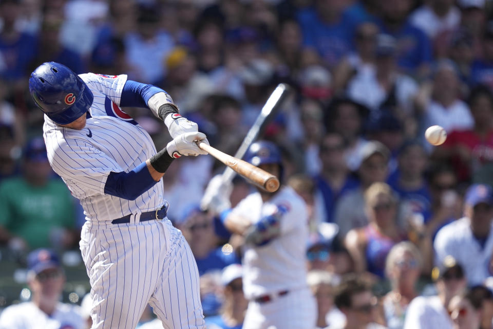 Chicago Cubs' Yan Gomes hits an RBI single off San Francisco Giants starting pitcher Logan Webb during the seventh inning of a baseball game Monday, Sept. 4, 2023, in Chicago. (AP Photo/Charles Rex Arbogast)