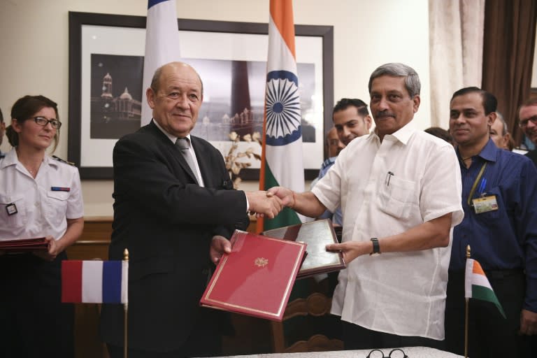 French defence minister Jean Yves le Drian (left) and his Indian counterpart Manohar Parrikar signed the the deal to purchase 36 French Rafale fighter jets in New Delhi on September 23, 2016