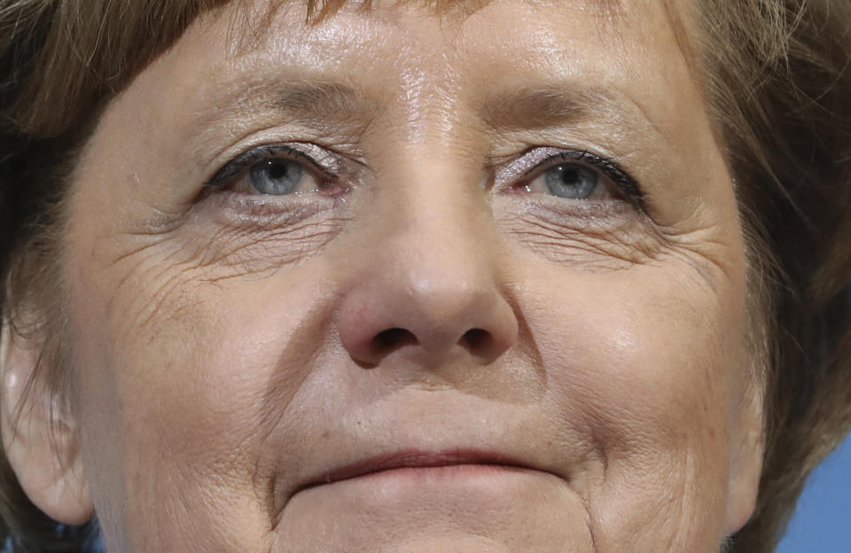 File - In this Friday, Jan. 12, 2018, file photo, German Chancellor Angela Merkel smiles during a joint statement after the exploratory talks between Merkel's Christian Democratic block and the Social Democrats on forming a new German government in Berlin, Germany. Angela Merkel will leave office in the coming months with her popularity intact, despite her party’s dismal election result. (AP Photo/Michael Sohn)