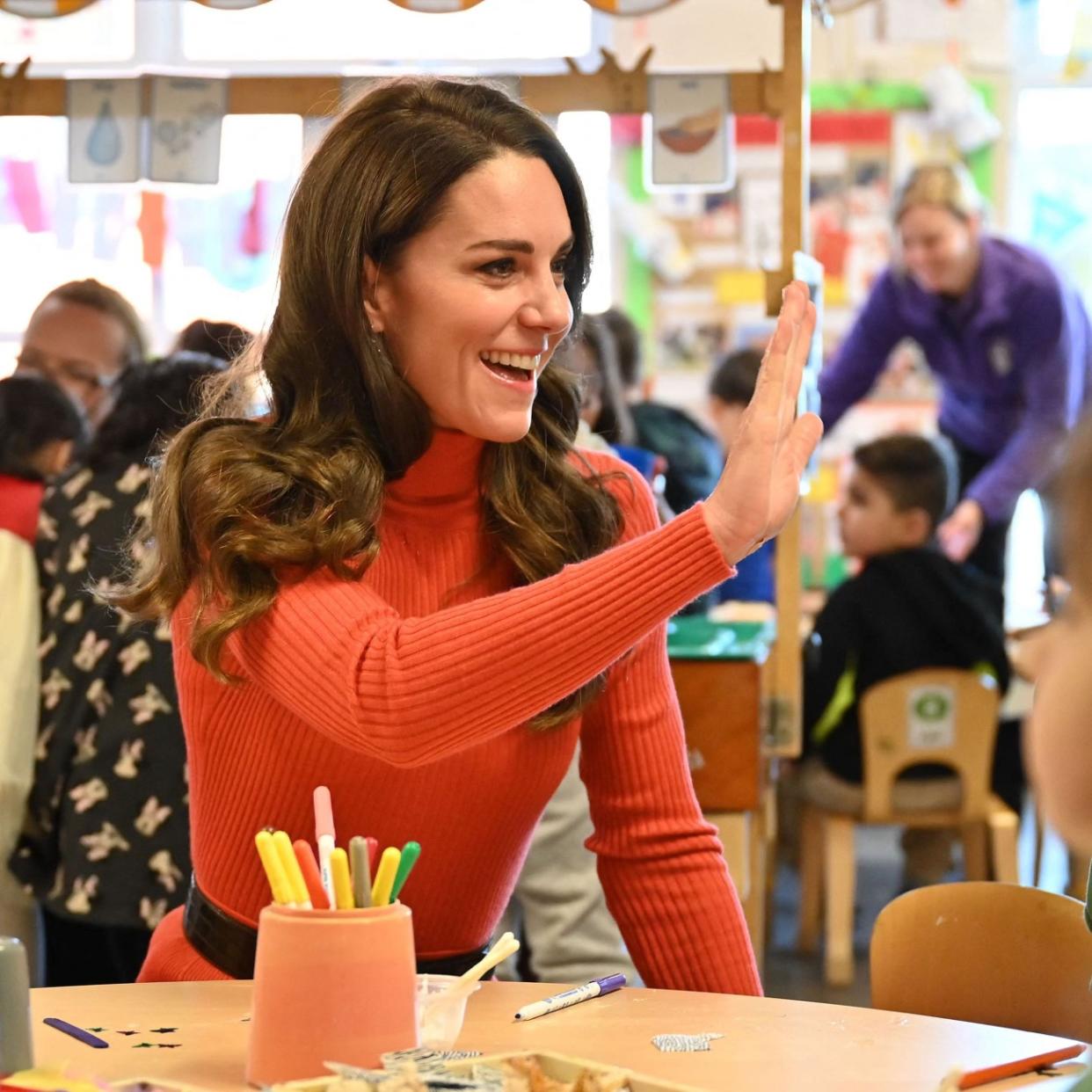  Britain's Catherine, Princess of Wales interacts with children making face masks during her visit to Foxcubs Nursery in Luton, north of London on January 18, 2023, as part of her ongoing work to elevate the importance of early childhood to lifelong outcomes.  