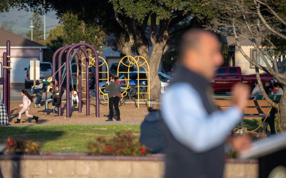 Children play as Rep. Jimmy Panetta (D-Carmel Valley) talks to local elected officials and community leaders about the bipartisan Infrastructure Investment and Jobs Act at Closter Park in Salinas, Calif., on Wednesday, Jan. 5, 2022.