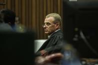 Prosecutor Gerrie Nel looks on during the murder trial of Olympic and Paralympic sprinter Oscar Pistorius' girlfriend Reeva Steenkamp, in the North Gauteng High Court in Pretoria, May 14, 2014. A South African court on Wednesday ordered Pistorius to undergo evaluation for mental illness, further delaying a murder trial that has already stretched into its 32nd day. REUTERS/Gianluigi Guercia/Pool (SOUTH AFRICA - Tags: SPORT CRIME LAW ATHLETICS)