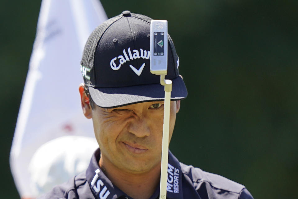 Kevin Na lines up his shot on the first green during the third round of the Tour Championship golf tournament Saturday, Sept. 4, 2021, at East Lake Golf Club in Atlanta. (AP Photo/Brynn Anderson)