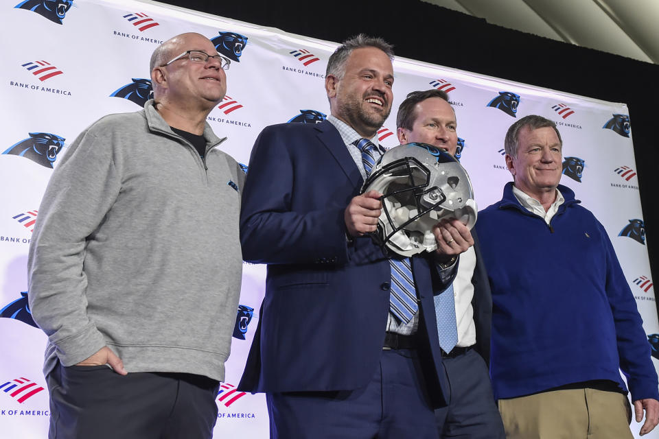 Carolina Panthers team owner, David Tepper, from left, poses with new head coach Matt Rhule, team president of business Tom Glick and general manager Marty Hurney during a news conference at the teams practice facility, Wednesday, Jan. 8, 2020, in Charlotte, N.C. (AP Photo/Mike McCarn)