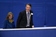 Virginia Gov. Glenn Youngkin, right, walks with his wife, Suzzanne Youngkin, during the gubernatorial inauguration ceremony, Saturday, Jan. 15, 2022, in Richmond, Va. (AP Photo/Julio Cortez)