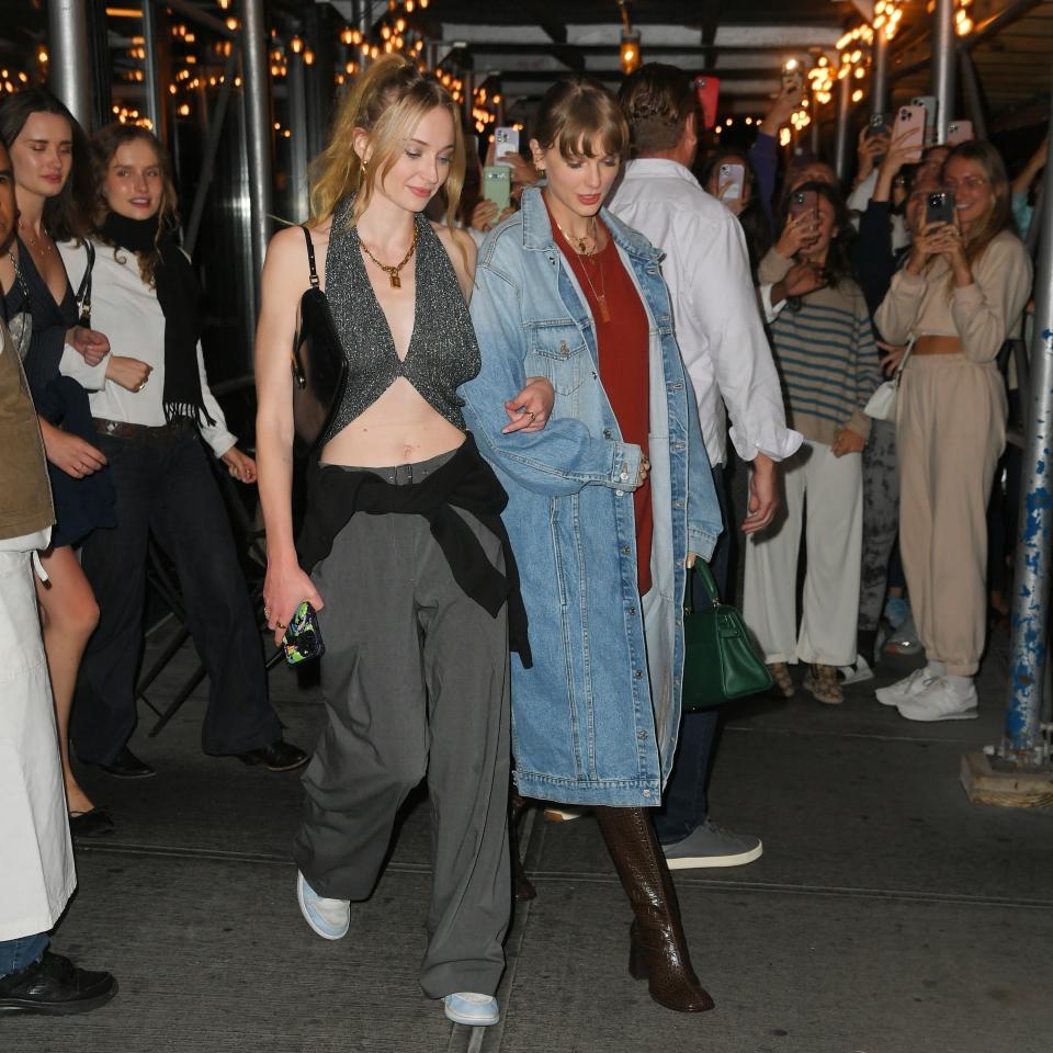 Closeup of Sophie and Taylor walking arm-in-arm