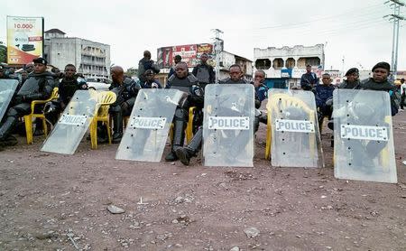 Congolese policemen take a break at a motorcycle taxi park as opposition activists march to press President Joseph Kabila to step down in the Democratic Republic of Congo's capital Kinshasa, September 19, 2016. REUTERS/Stringer