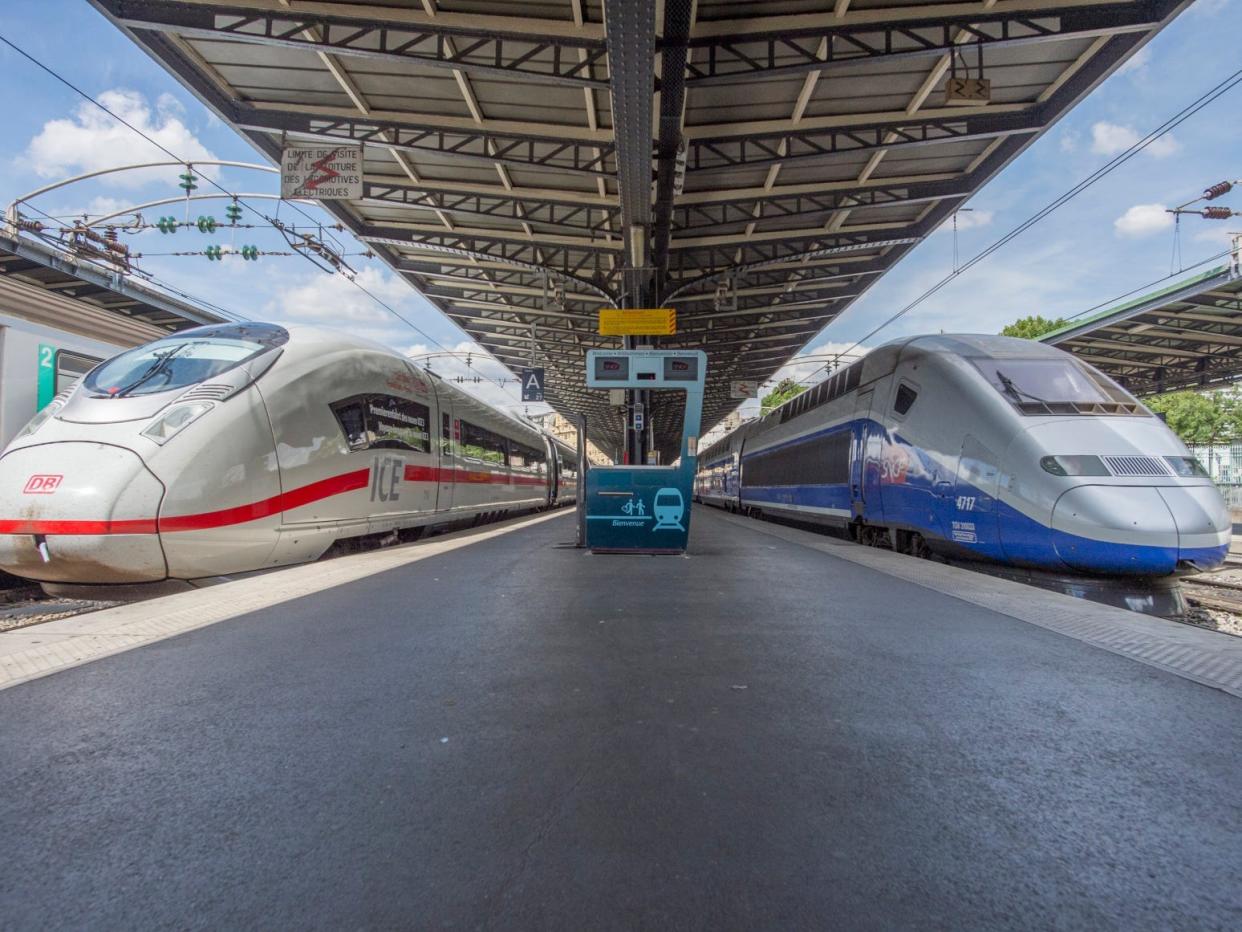 Two trains at terminal.