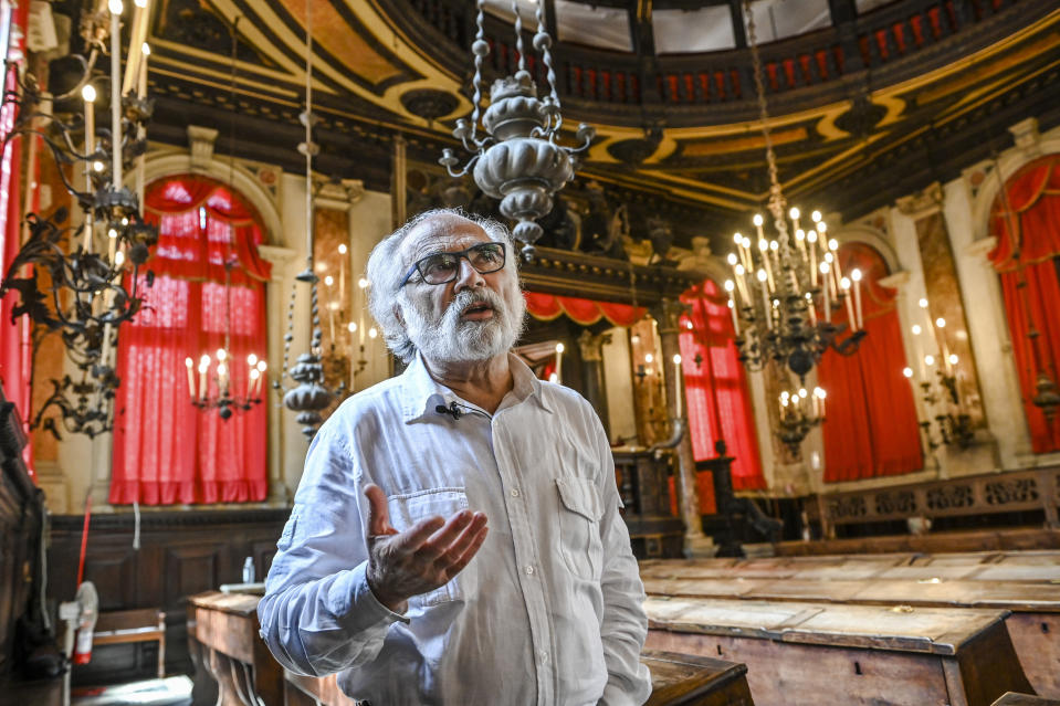 Dario Calimani, the president of the Jewish Community of Venice, poses inside the Spanish Schola Synagogue in Venice, northern Italy, Wednesday, June 1, 2022. The Spanish Schola, founded about 1580, but rebuilt in the first half of the 17th century, is the biggest of the Venetian synagogues. Venice’s Jewish ghetto is considered the first in Europe and one of the first in the world, and a new effort is underway to preserve its 16th century synagogues for the Jews who have remained and tourists who pass through. (AP Photo/Chris Warde-Jones)