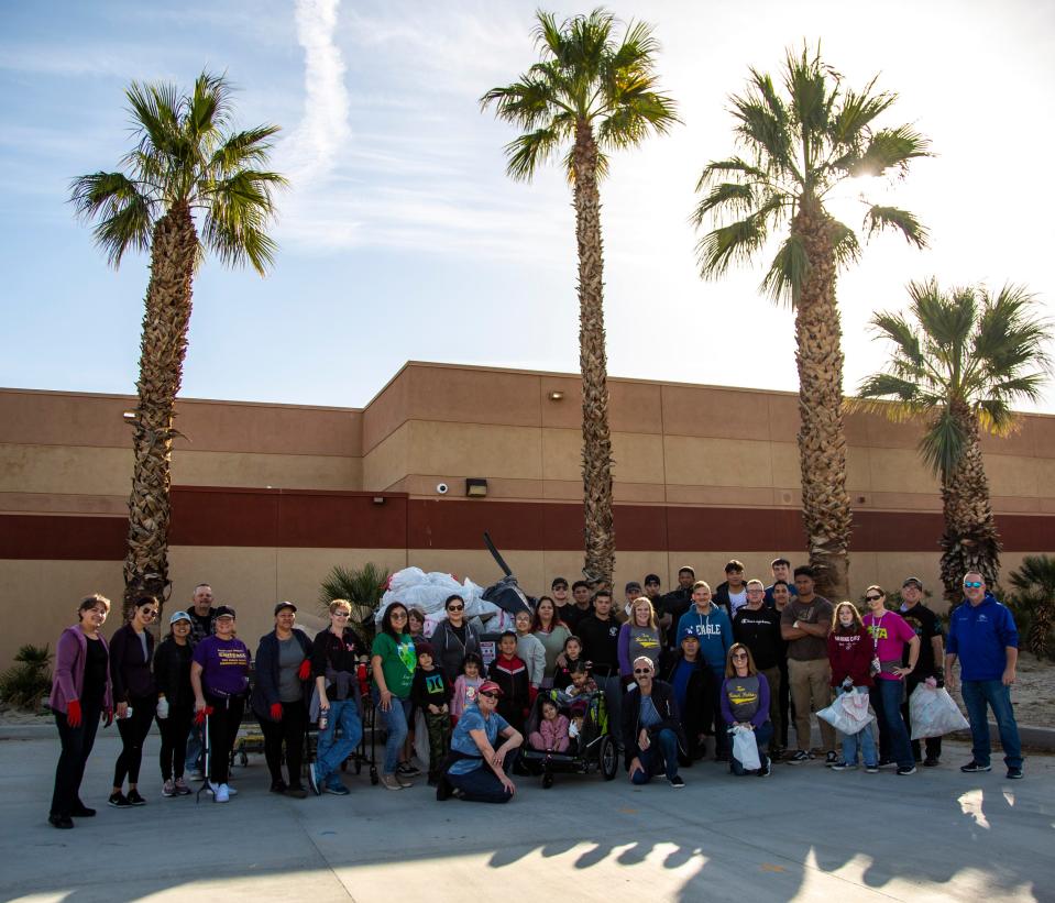 Volunteers pose for a group photo during a beautification committee clean-up at Two Bunch Palms Elementary School in Desert Hot Springs on Saturday, Feb. 4, 2023.