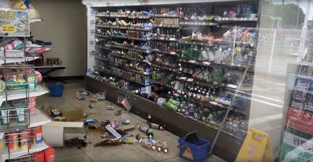 Bottled drinks are scattered on the floor of a shop after an earthquake hit Osaka, Japan June 18, 2018, in this still image taken from a video obtained from social media. MANDATORY CREDIT. Twitter/@tw_hds/via REUTERS