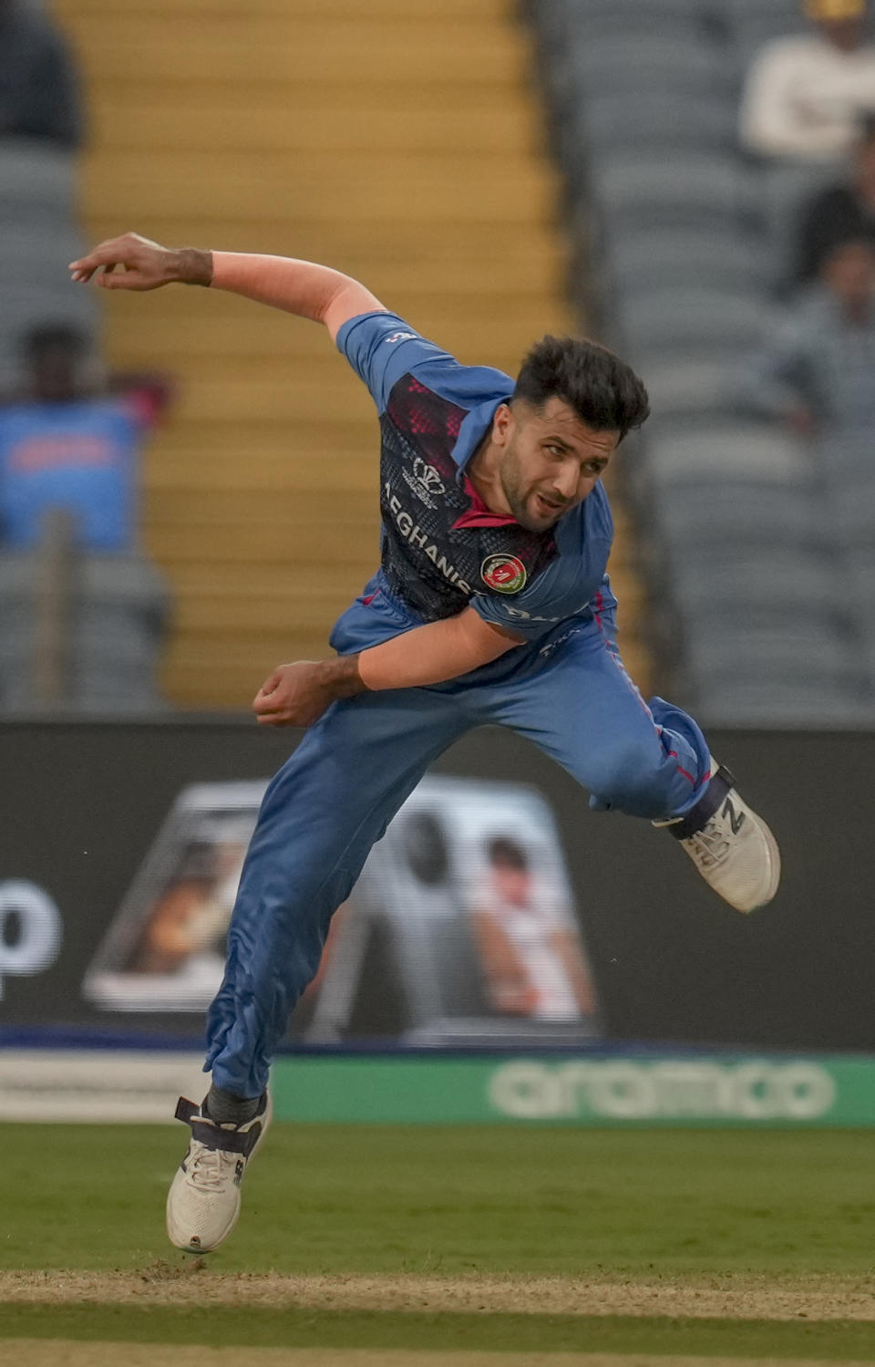 Afghanistan's Fazalhaq Farooqi bowls a delivery during the ICC Men's Cricket World Cup match between Sri Lanka and Afghanistan in Pune, India, Monday, Oct. 30, 2023. (AP Photo/Rajanish Kakade)