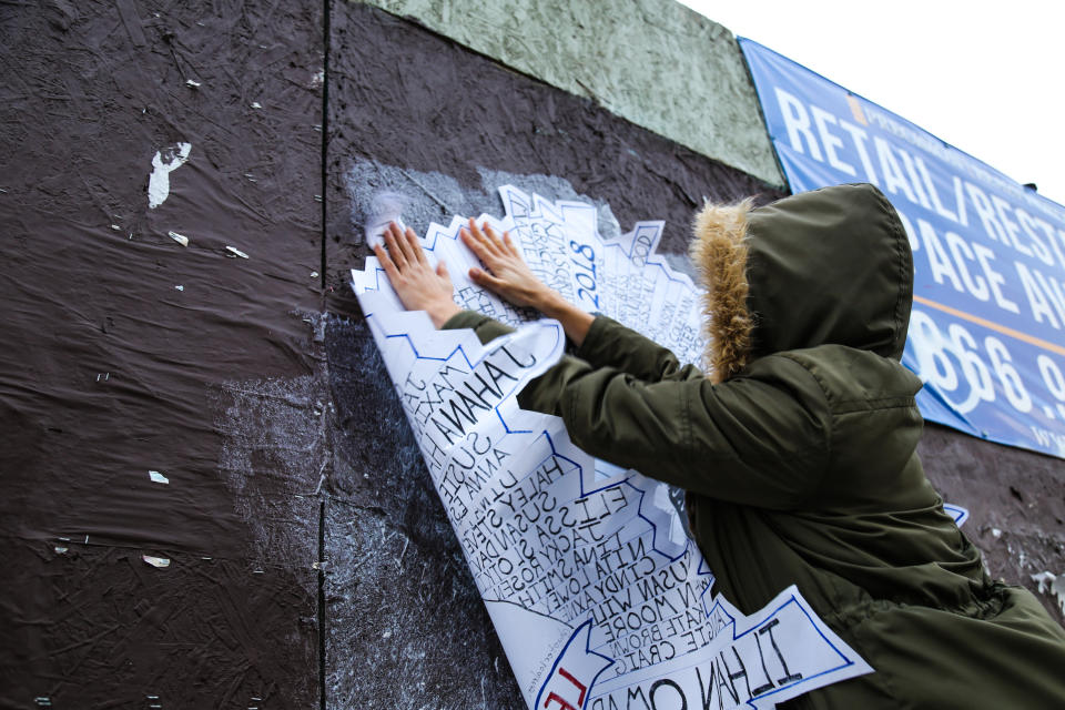 Street art newcomer Hysterical Men pastes her art on a wall in Philadelphia. (Credit: Streets Dept/ Conrad Benner)