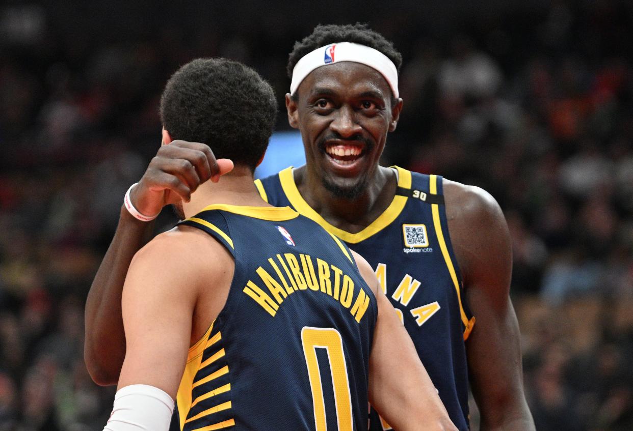 Apr 9, 2024; Toronto, Ontario, CAN; Indiana Pacers guard Tyrese Haliburton (0) is embraced by forward Pascal Siakam (43) after scoring a basket against the Toronto Raptors in the second half at Scotiabank Arena. Mandatory Credit: Dan Hamilton-USA TODAY Sports