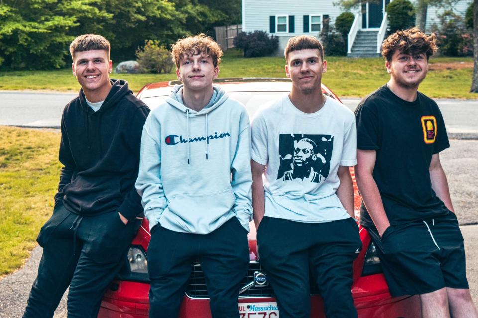 Jonathan, Scott, Jason and Riley Lynch are quadruplets in the Somerset Berkley Regional High School Class of 2023. Here, they are seen in the driveway of their home in Berkley leaning on the Volvo they share.
