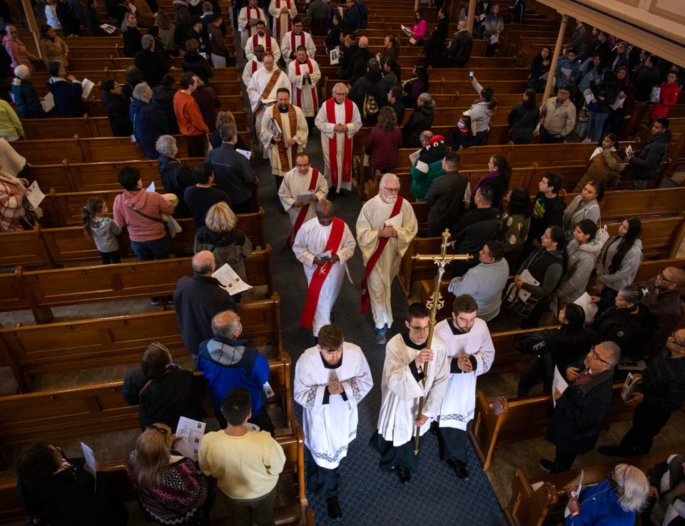 A Stations of the Cross procession leaves St. John’s Church to make stops through downtown on Good Friday.