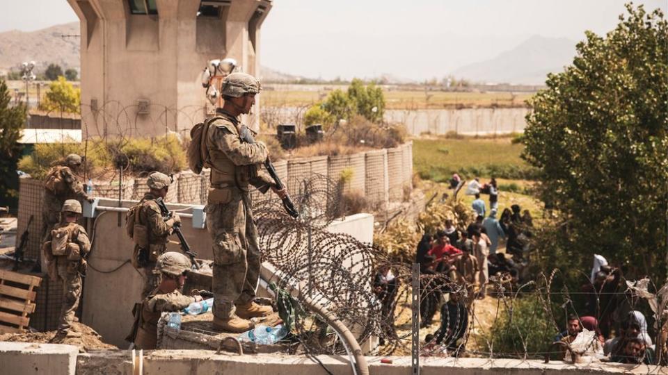 US troops stand guard at an Evacuee Control Checkpoint at Hamid Karzai International Airport, Kabul, Afghanistan, 20 August 2021