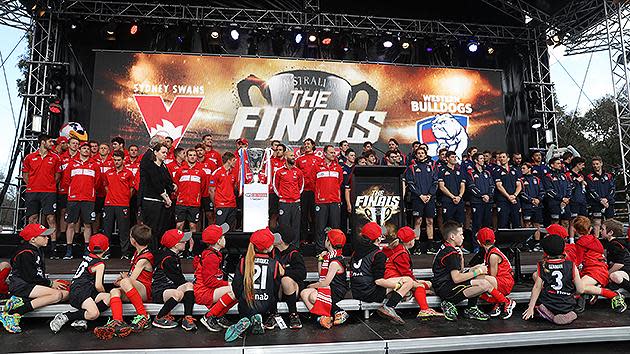 The competing teams are presented to fans on stage during the grand final parade. Pic: Getty