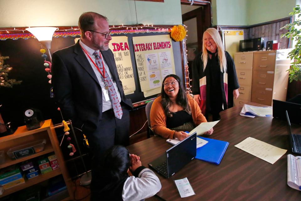Andrew O'Leary, New Bedford Superintendent of Schools, speaks with Nya Salter, a para educator, who was a former student of Darcie Aungst, new Deputy Superintendent, during a stop at the Congdon Elementary School on Hemlock Street in New Bedford.