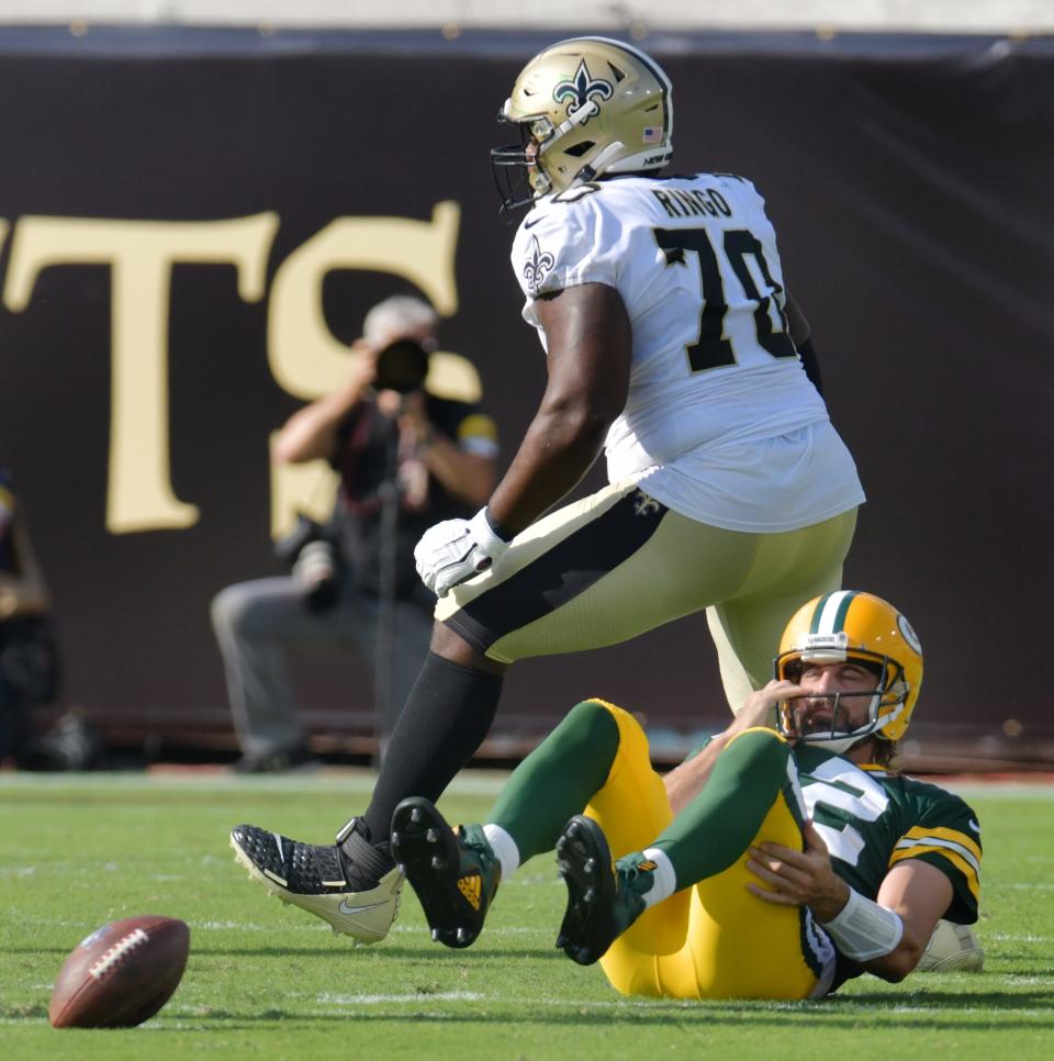 New Orleans Saints defensive end Christian Ringo celebrates after a second-quarter sack on Green Bay Packers quarterback Aaron Rodgers on Sept. 12 in Jacksonville, Florida. The Packers will host the Saints in this year's only preseason game at Lambeau Field in Green Bay.