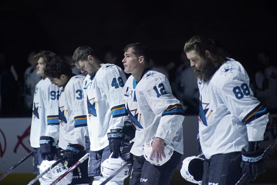 San Jose Sharks center Patrick Marleau (12) stands on the ice during the national anthem before the first period of an NHL hockey game Monday, April 19, 2021, in Las Vegas. (AP Photo/John Locher)