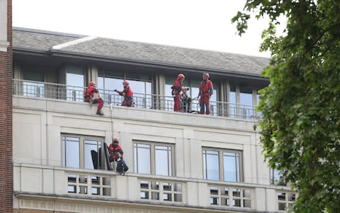 Greenpeace activists at BP's London headquarters - Credit: Aaron Chown/PA