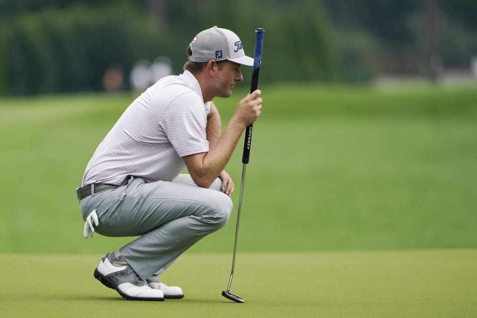Webb Simpson lines up a putt on the first hole during the third round of the Wyndham Championship golf tournament at Sedgefield Country Club on Saturday, Aug. 15, 2020, in Greensboro, N.C. (AP Photo/Chris Carlson)